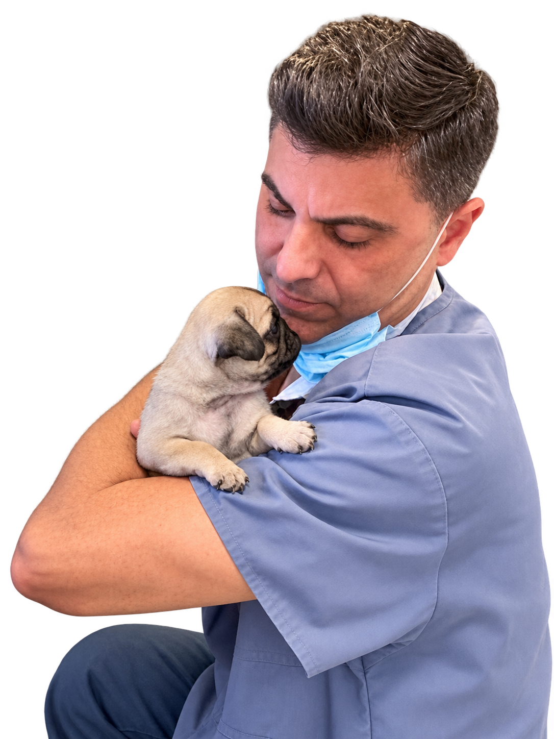 Dr. Eduardo Díaz-Argimón sosteniendo un cachorro